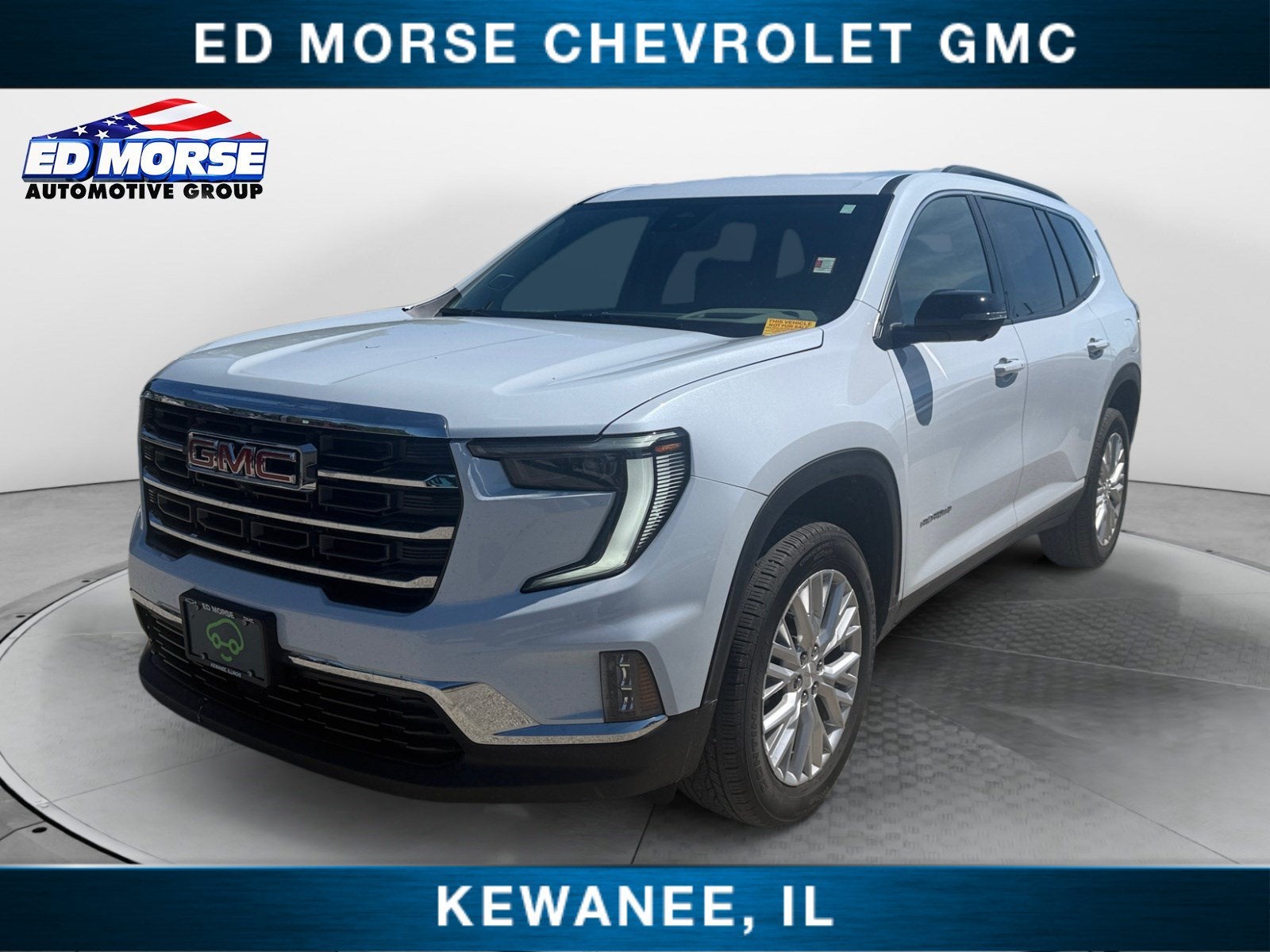 2026 GMC Acadia Elevation in Glacier White Tricoat — front three-quarter view